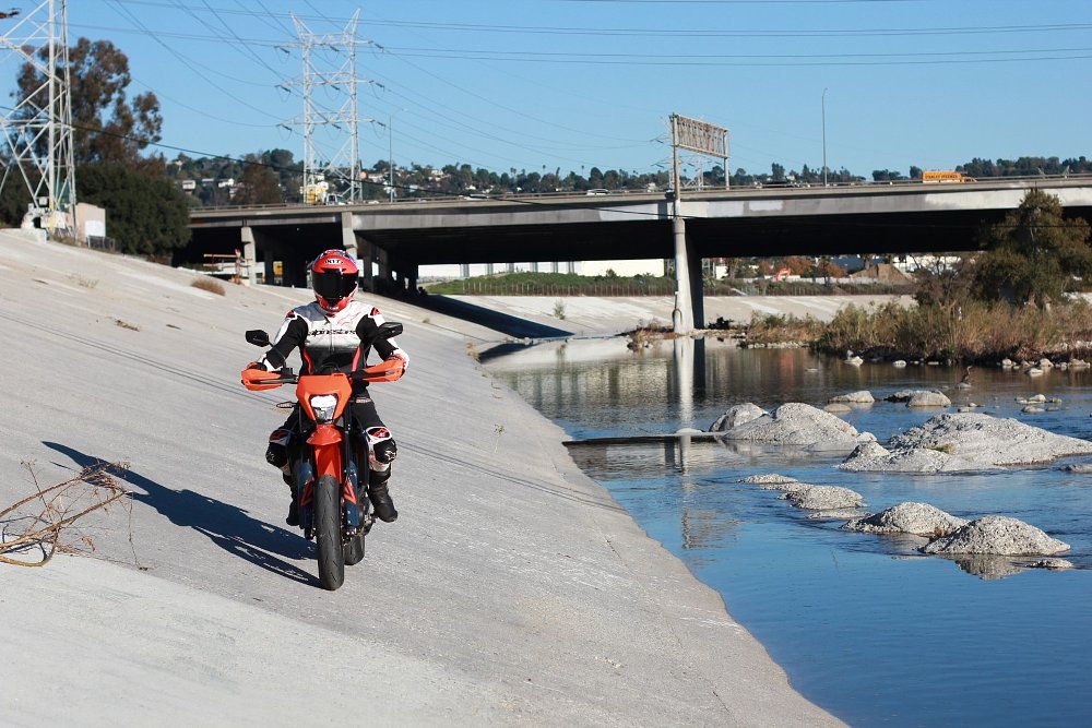 riding the SMC R on the paved bank of the river in Los Angeles