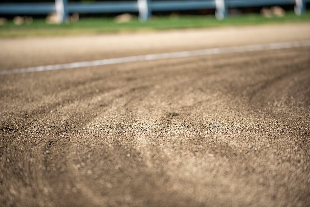 Up close on the surface of a motorcycle dirt track.